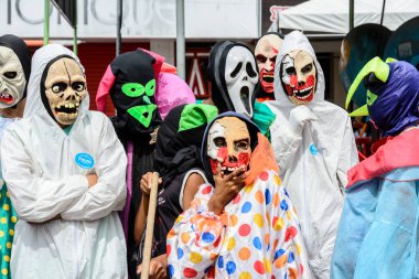 Maragogipe, Bahia, Brazil - February 27, 2017: Group of people parading dressed in horror costumes at the carnival in Maragojipe, Bahia.