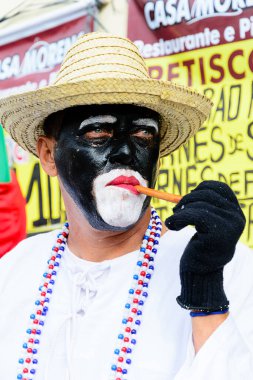 Maragogipe, Bahia, Brazil - February 27, 2017: People participate in the street carnival in the city of Maragogipe in Bahia, dressed in colorful clothes.