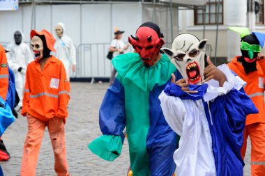 Maragogipe, Bahia, Brazil - February 27, 2017: Group of people parading dressed in horror costumes at the carnival in Maragojipe, Bahia.