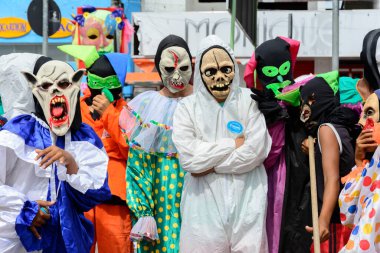 Maragogipe, Bahia, Brazil - February 27, 2017: Group of people parading dressed in horror costumes at the carnival in Maragojipe, Bahia.