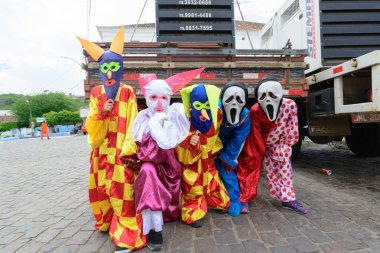 Maragogipe, Bahia, Brazil - February 27, 2017: Group of people parading dressed in horror costumes at the carnival in Maragojipe, Bahia.