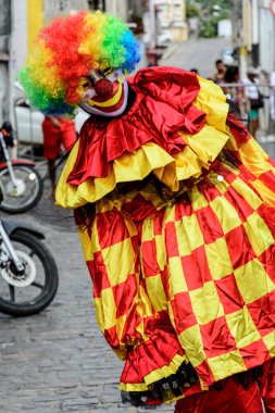 Maragogipe, Bahia, Brazil - February 27, 2017: A person dressed up in Venice carnival style has fun during the street carnival in the city of Maragogipe in Bahia.