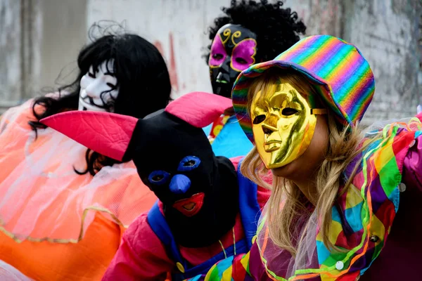 Maragogipe, Bahia, Brazil - February 27, 2017: Group of people wearing Venice carnival costumes during the carnival parade in the city of Maragojipe, Bahia.