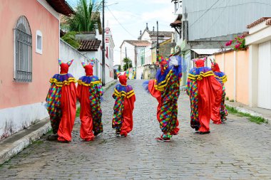 Maragogipe, Bahia, Brazil - February 27, 2017: Group of people wearing Venice carnival costumes during the carnival parade in the city of Maragojipe, Bahia.