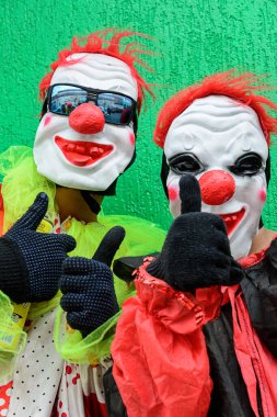Maragogipe, Bahia, Brazil - February 27, 2017: Two people with horror masks parading at the carnival in the city of Maragogipe, Bahia.