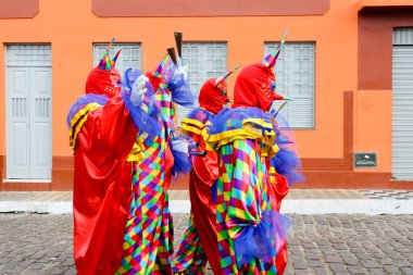 Maragogipe, Bahia, Brazil - February 27, 2017: Group of people wearing Venice carnival costumes during the carnival parade in the city of Maragojipe, Bahia.
