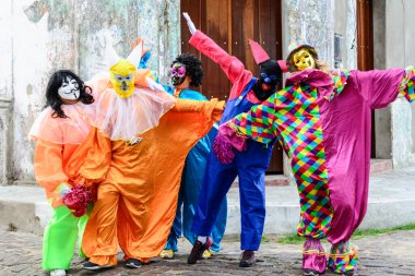 Maragogipe, Bahia, Brazil - February 27, 2017: Group of people wearing Venice carnival costumes during the carnival parade in the city of Maragojipe, Bahia.