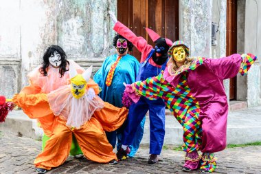 Maragogipe, Bahia, Brazil - February 27, 2017: Group of people wearing Venice carnival costumes during the carnival parade in the city of Maragojipe, Bahia.
