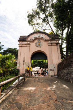 Cairu, Bahia, Brazil - January 19, 2023: People passing through the entrance portal of Morro de Sao Paulo, in the city of Cairu.