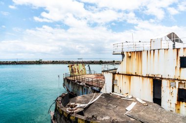 Itaparica, Bahia, Brazil - January 24, 2023: Old and rusty ferry boat stopped in the harbor waiting for repairs. Itaparica, Bahia.