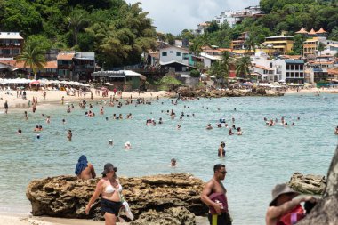 Cairu, Bahia, Brazil - January 19, 2023: People walking on the sands of Morro de Sao Paulo beach, in the city of Cairu.