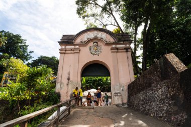 Cairu, Bahia, Brazil - January 19, 2023: People passing through the entrance portal of Morro de Sao Paulo, in the city of Cairu.