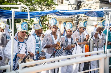 Salvador, Bahia, Brazil - February 11, 2018: Musicians from the traditional carnival group Filhos de Gandy, parade through the streets of Salvador, Bahia, during Carnival.