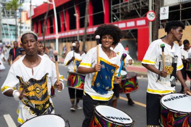 Salvador, Bahia, Brazil - February 11, 2023: Group of musicians play percussion during the Fuzue carnival parade in Salvador, Bahia.