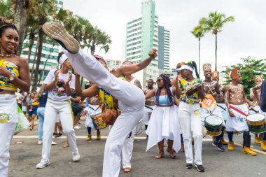 Salvador, Bahia, Brazil - February 11, 2023: Capoeira groups parade during the pre-Carnival Fuzue, in Salvador, Bahia.