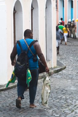 Salvador, Bahia, Brazil - June 22, 2018: Workers are seen walking down the Pelourinho slope in Salvador, Bahia.