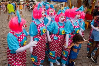 Maragogipe, Bahia, Brazil - February 20, 2023: Group of people dressed as clowns parade during the carnival in the city of Maragogipe. Bahia Brazil.