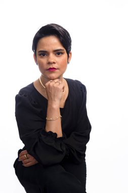 Confident young female lawyer with hand on chin. Isolated on white background.