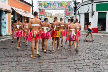 Maragogipe, Bahia, Brazil - February 20, 2023: Group of men dressed as women are parading in the carnival of the city of Maragogipe, in Bahia.