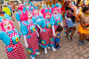 Maragogipe, Bahia, Brazil - February 20, 2023: Group of people dressed as clowns parade during the carnival in the city of Maragogipe. Bahia Brazil.