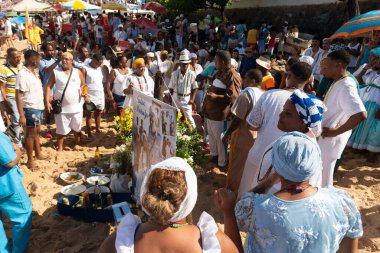 Salvador, Bahia, Brazil - February 02, 2023: Thousands of people are on the beach offering gifts to Yemanja on Rio Vermelho beach in Salvador.