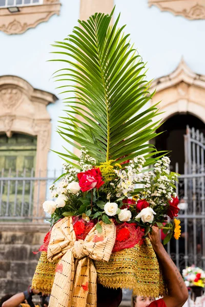 stock image Salvador, Bahia, Brazil - December 04, 2022: A Catholic faithful is seen carrying an image of Santa Barbara in Pelourinho, Salvador, Bahia.