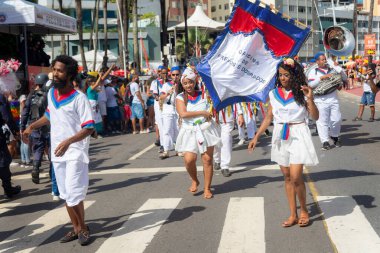 Salvador, Bahia, Brazil - February 11, 2023: Dance group parades during the pre-Carnival Fuzue presentation in the city of Salvador, Bahia.