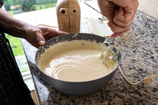 stock image Electric mixer being used to prepare cheesecake ingredients. Family gastronomy.