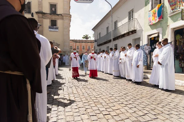 stock image Salvador, Bahia, Brazil - June 16, 2022: Catholic priests are seen participating in the corpus christi procession in the streets of Pelourinho, Salvador, Bahia.