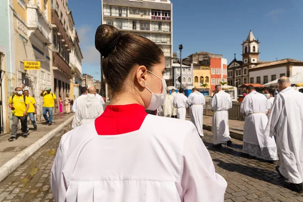 stock image Salvador, Bahia, Brazil - June 16, 2022: Catholic priests participate in the corpus christi procession in the streets of Pelourinho, Salvador, Bahia.