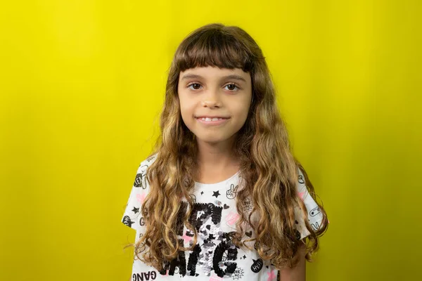 Portrait Caucasian Child Long Hair Beautiful Smiling Isolated Yellow Background — Stock Photo, Image