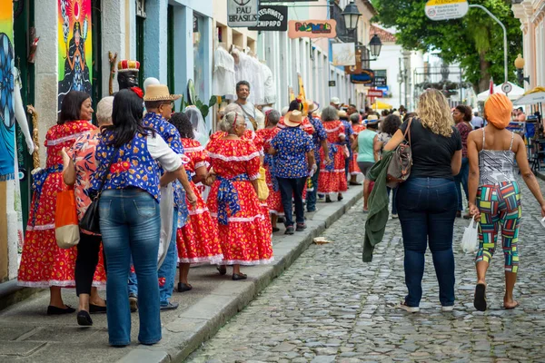 stock image Salvador, Bahia, Brazil - June 15, 2023: Elderly people are seen walking in the streets of Pelourinho dressed in clothes for the feast of Sao Joao in Salvador, Bahia