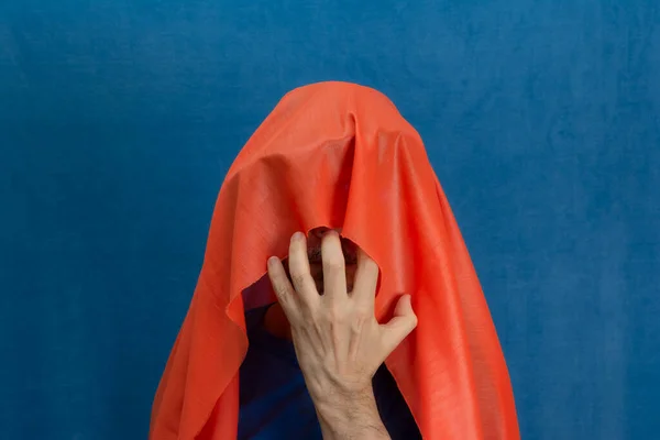 Man Completely Covering His Head Orange Cloth One Hand Front — Stock Photo, Image