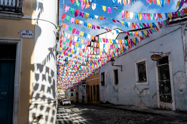 stock image Salvador, Bahia, Brazil - June 15, 2023: Streets and houses of Pelourinho decorated with colorful flags for the feast of Sao Joao in Salvador, Bahia.