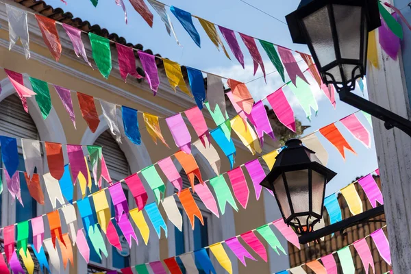 stock image Salvador, Bahia, Brazil - June 15, 2023: Facade of old houses in Pelourinho decorated with colorful flags for the feast of Sao Joao in the month of June in Salvador, Bahia.