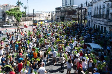 Salvador, Bahia, Brazil - April 02, 2023: Thousands of Catholics participate in the Palm Sunday procession in the city of Salvador, Bahia.