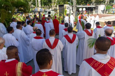 Salvador, Bahia, Brazil - April 02, 2023: Catholic church priests attend a Palm Sunday mass in the city of Salvador, Bahia.