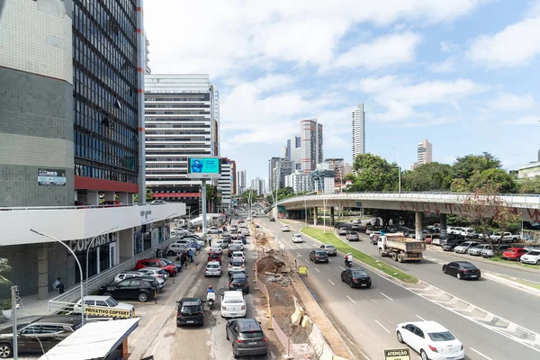 stock image Salvador, Bahia, Brazil - August 11, 2023: View of a street close to Avenida Tancredo Neves with a construction site on the side. City of Salvador, Bahia.