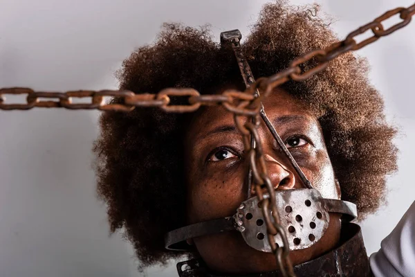 Portrait of a black woman in chains, representing the slave Anastacia. Slavery in Brazil.