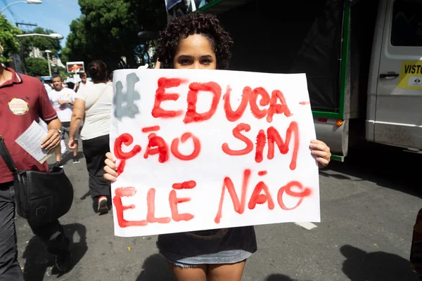stock image Salvador, Bahia, Brazil - May 30, 2019: People are seen protesting with posters against the cuts in education funding by President Jair Bolsonaro in the city of Salvador, Bahia.