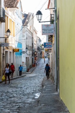 Salvador, Bahia, Brazil - February 07, 2015: People walk through the cobblestone streets of Pelourinho, the historic center of the city of Salvador, Bahia.