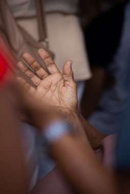 Hands of a religious person in prayer. Concept of religiosity.