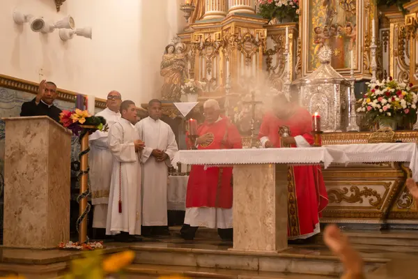 stock image Salvador, Bahia, Brazil - December 13, 2023: Priests celebrate mass for Santa Luzia at the Pilar church in the city of Salvador, Bahia.