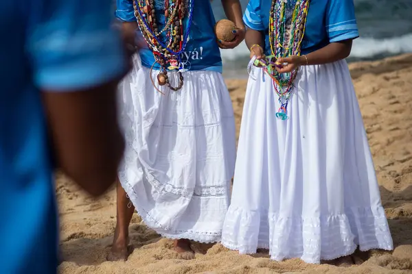 stock image Salvador, Bahia, Brazil - February 02, 2024: Candomble fans are seen paying homage to Iemanja on Rio Vermelho beach, in the city of Salvador, Bahia.