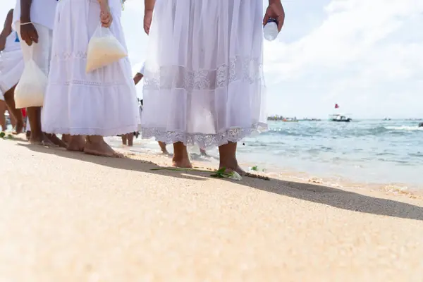 stock image Salvador, Bahia, Brazil - February 02, 2024: Members of Candomble are seen on the shore of Rio Vermelho beach to pay homage to Iemanja in the city of Salvador, Bahia.