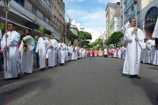 Salvador, Bahia, Brazil - April 14, 2019: Priests are seen participating in the Palm Sunday procession in the city of Salvador, Bahia.