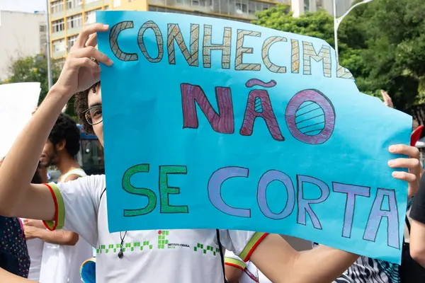 stock image Salvador, Bahia, Brazil - August 13, 2019: Students are seen with signs during a protest against cuts to education by President Jair Bolsonaro in the city of Salvador, Bahia.