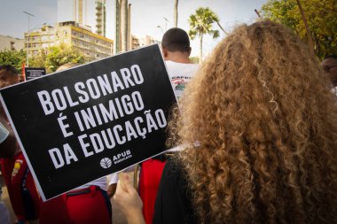Salvador, Bahia, Brazil - September 07, 2019: Student activists protest during the celebration of Brazilian independence day in Campo Grande square. Salvador, Bahia. clipart