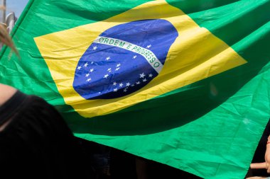 Salvador, Bahia, Brazil - September 07, 2019: Students protest with flags and posters during the celebration of Brazilian Independence Day. Salvador, Bahia. clipart