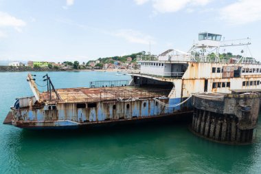 Vera Cruz, Bahia, Brazil - January 24, 2023: View of a rusty and abandoned Ferry Boat at the Bom Despacho maritime terminal in the city of Vera Cruz in Bahia. clipart
